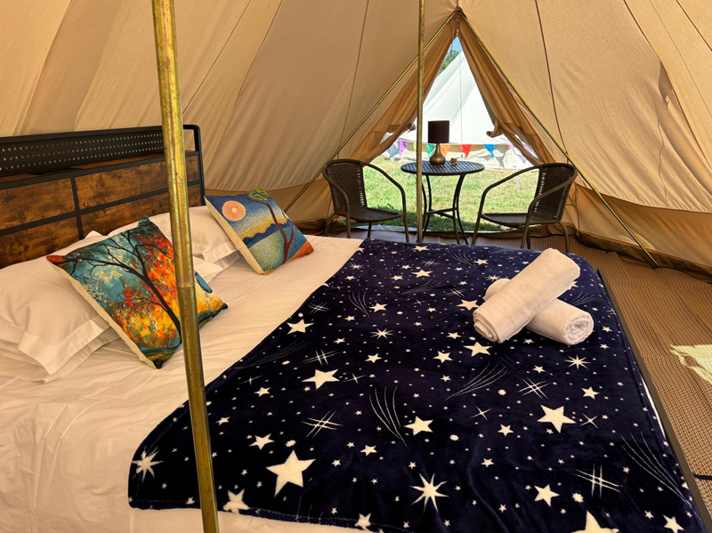 Emperor Bell Tent has a Super king-size bed with up to 2 extra single beds